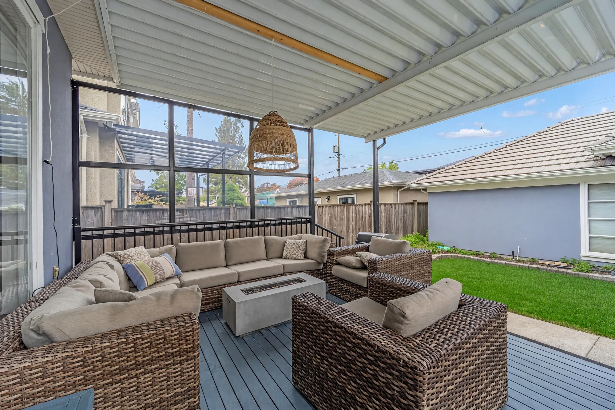 From the deck sofas toward the lawn and the garage