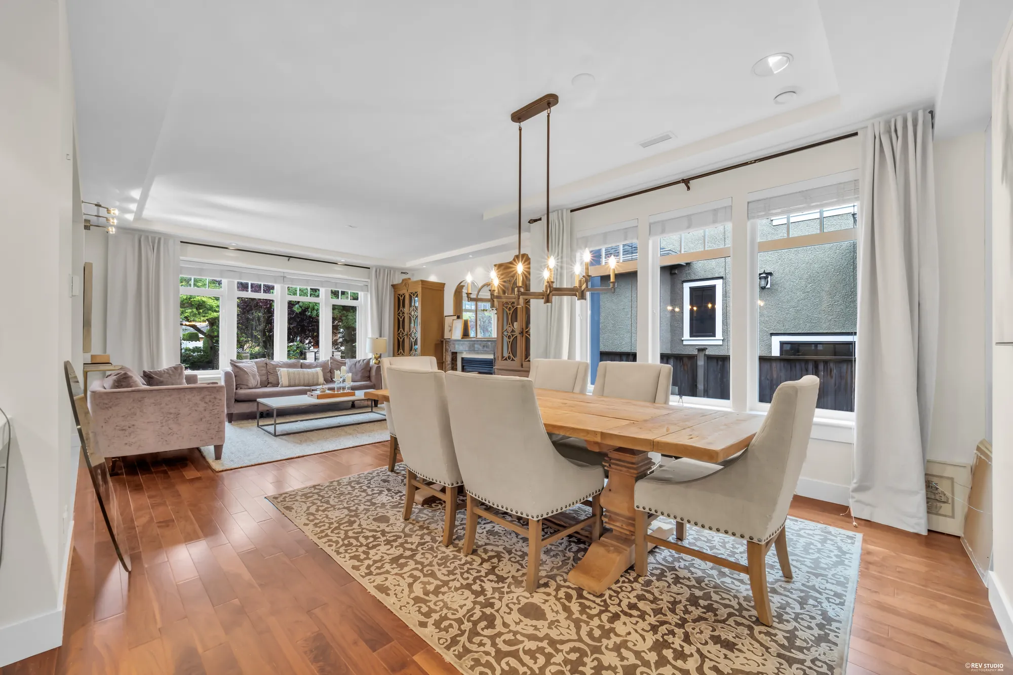 The dining table toward the family room and the kitchen beyond